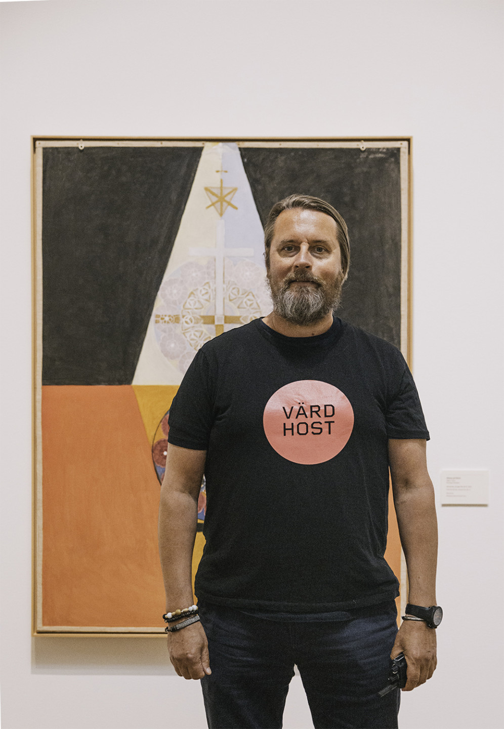 A person in front of a painting